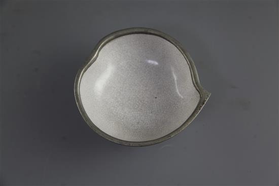 A Chinese Yixing pottery and pewter mounted peach shaped cup, late 19th century, length 13cm